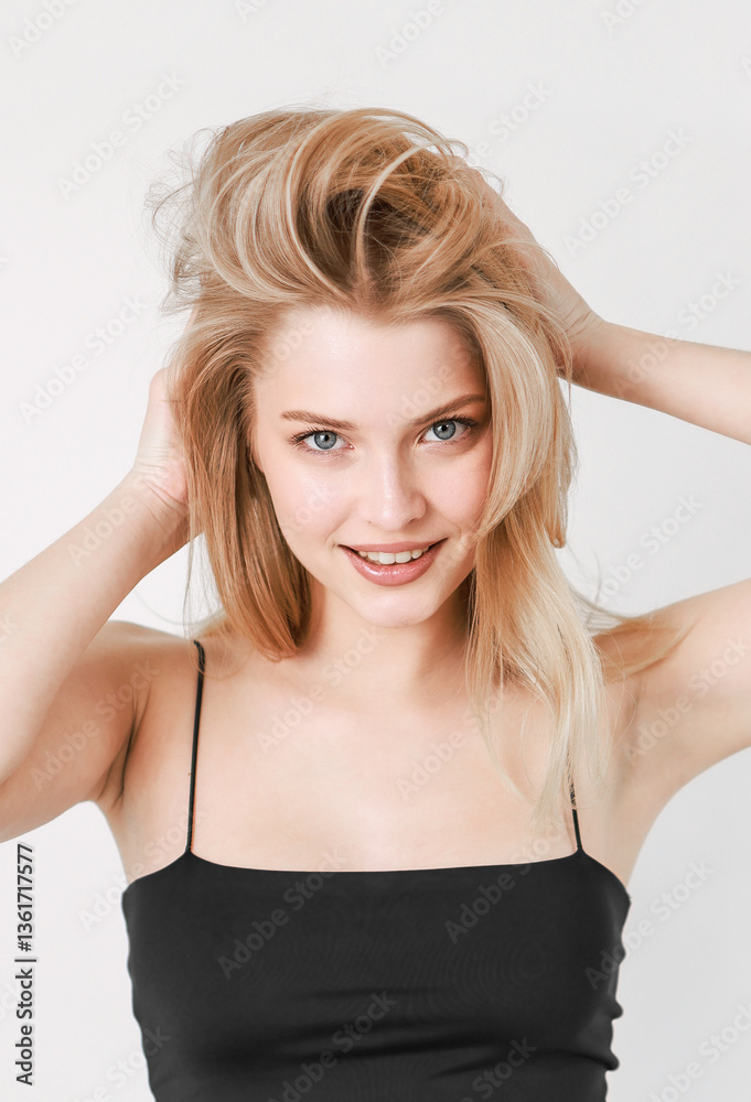 Portrait of a smiling beautiful blonde in a black top. Portrait of a smiling beautiful blonde in a black top.