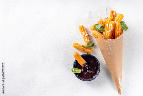 Churros with sugar powder and chocolate