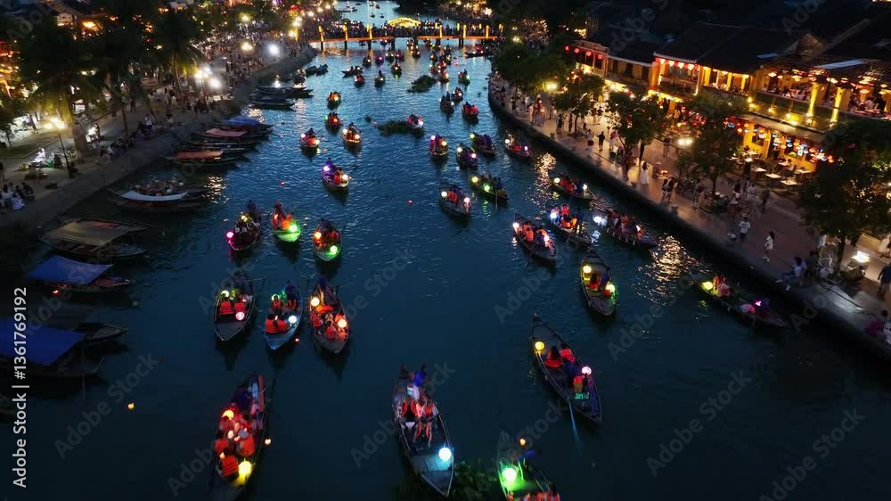 Drone video Hoi An, Vietnam in Quang Nam Province is a popular tourist destination, with colorful lantern boats sailing along the river at night.