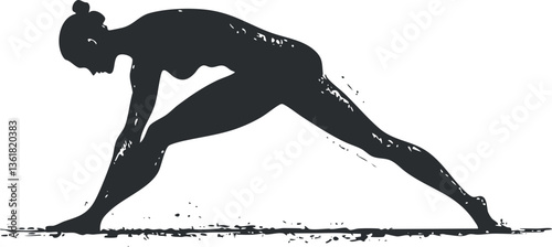 Silhouette of a woman performing a yoga pose for fitness and flexibility themes.