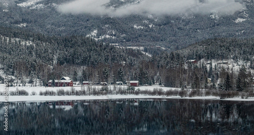 winter mountains and mountain lake, snow-capped peaks of Norwegian low mountains
