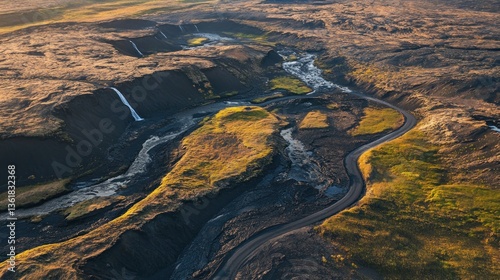Dramatic aerial landscape of Iceland with road, river and black volcanic terrain
