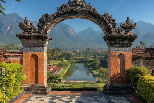 Wallpaper Mural Beautiful Balinese temple archway overlooking lush landscape with distant mountains on a sunny day Torontodigital.ca