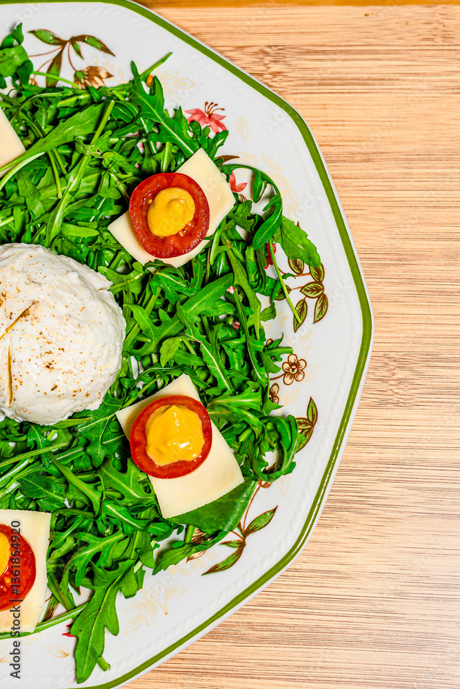 Salad with arugula, cheese and poached egg. Salad with arugula, cheese and poached egg.