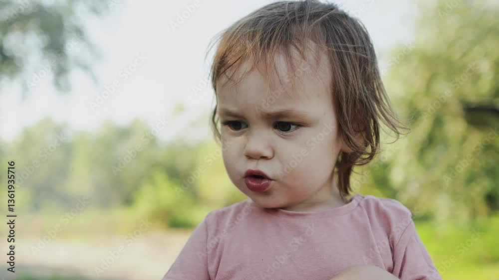 An Emotional Toddler Expressing Deep Confusion While Exploring Nature in the Outdoors An Emotional Toddler Expressing Deep Confusion While Exploring Nature in the Outdoors
