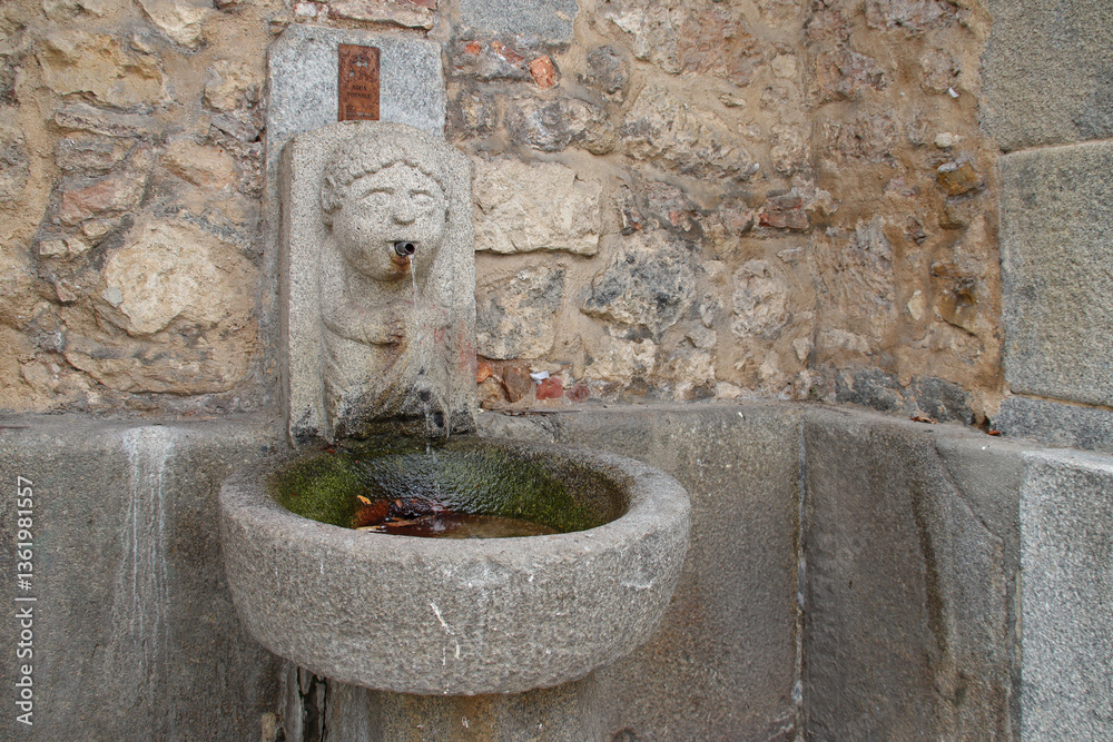 old sculpted fountain in segovia in spain