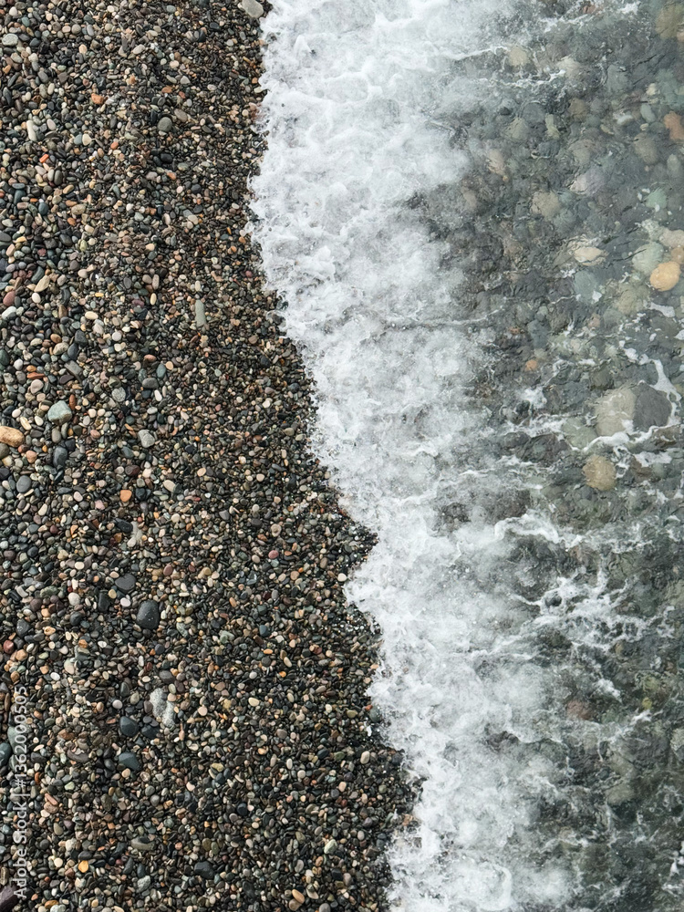 Gentle waves washing over a pebble beach