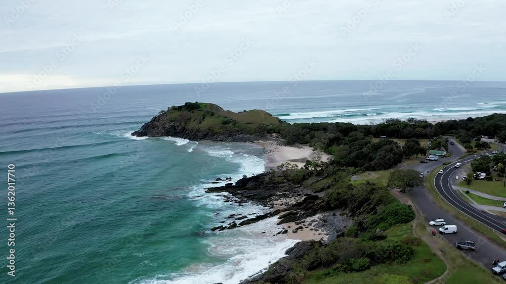 Soar above the stunning Cabarita Headland in NSW with this 4K drone footage. Watch as the coastline meets the ocean in a mesmerizing display of nature's beauty, offering a perfect aerial view.