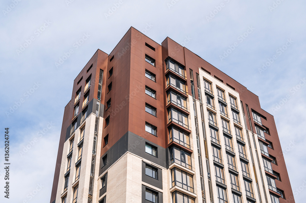 A modern and new residential building. Multi-storey modern, new and stylish residential complex against the sky A modern and new residential building. Multi-storey modern, new and stylish residential complex against the sky