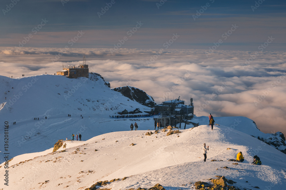 Snow-covered peaks of the Tatra Mountains with Kasprowy Wierch in winter. Stunning alpine scenery, perfect for skiing, hiking, and photography. Cold, crisp air and breathtaking views