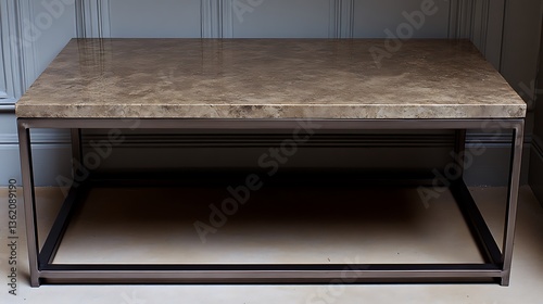 Modern coffee table with stone top and metal frame.