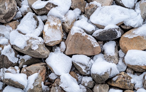 Wallpaper Mural Close-up view of rocks covered in a light layer of snow. The rocks are various shades of brown and gray, creating a textured surface.  The snow adds a cool, wintery feel Torontodigital.ca