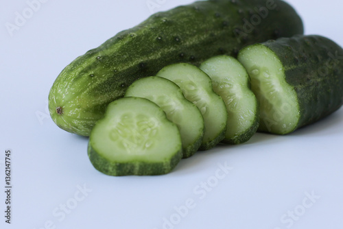 cucumber and slices. cucumbers on a wooden table	