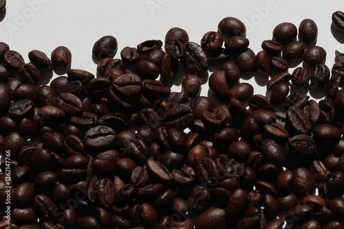 roasted coffee beans. view of coffee beans. Textured background with robusta and arabica coffee beans closeup. Every day, people drink aromatic strong espresso in the morning. A popular world drink.