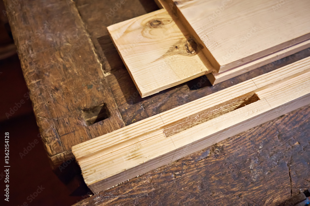 Close-up of wooden joints during the production of doors and other products by a carpenter. Selective focus. Close-up of wooden joints during the production of doors and other products by a carpenter. Selective focus.