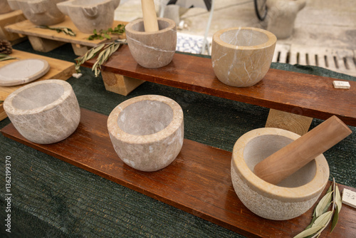 Handmade Stone Mortars with Wooden Pestles at an Artisan Market