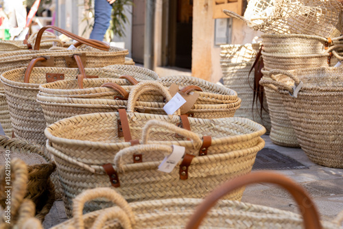 Handwoven Straw Baskets with Leather Handles at a Market