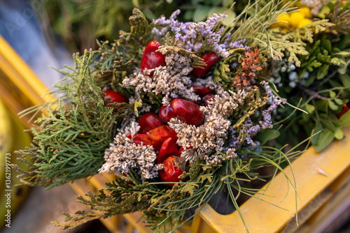 Rustic bouquet with red peppers and dried flowers