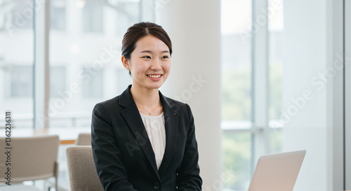 Job candidate smiling during interview in modern office setting  
