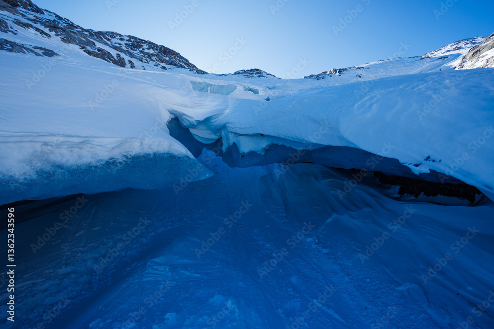 Pristine glacier ice formations create a natural frosty cave