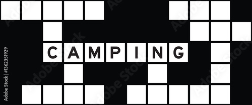 Alphabet letter in word camping on crossword puzzle background