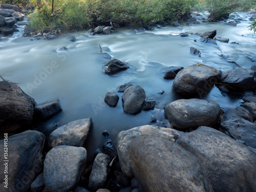 Serene Dawn Stream: Long Exposure at Phitsanulok Rapids