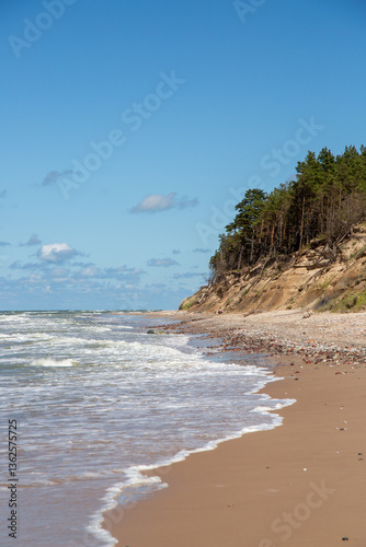 Fototapeta Naklejka Na Ścianę i Meble -  Staldzene steep coast beach at the Baltic sea in June in summer in Ventspils in Latvia