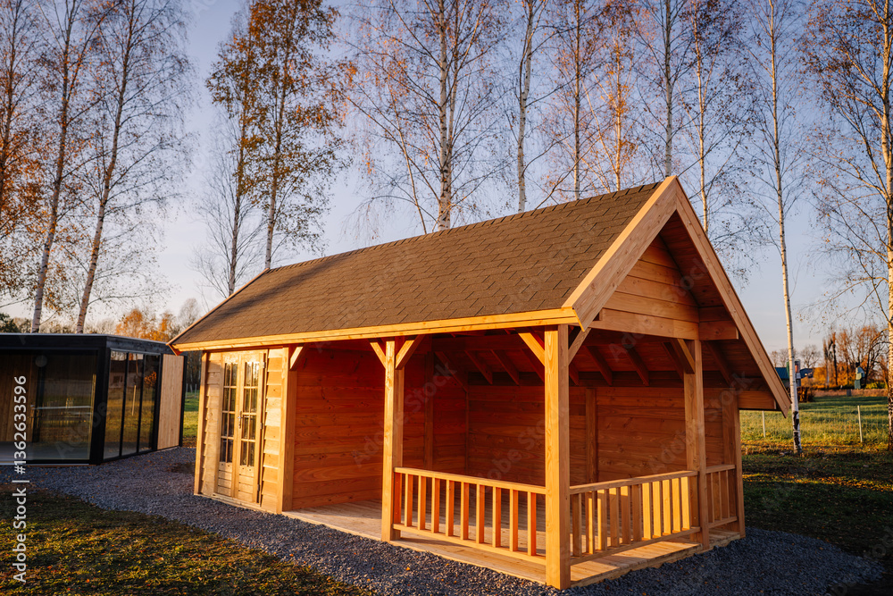 custom made wallpaper toronto digitalCozy wooden cabin with gable roof and small porch, captured in warm evening sunlight with birch trees in the background on a peaceful rural property..