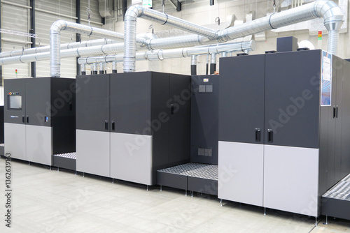 High volume industrial inkjet printer for reels of paper