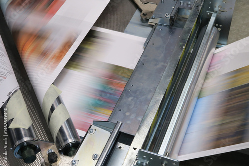 Industrial colors printing machine working on continuing reels of paper with modern inkjet technology