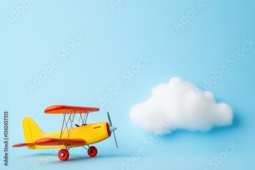 Colorful Toy Airplane Against Blue Background with White Cloud