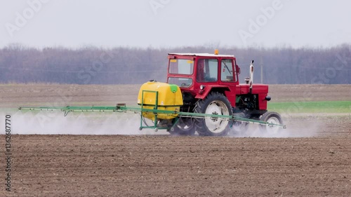 an agricultural machine that spreads herbicide on a field