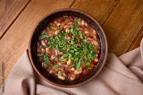 Obraz na płótnie Homemade Bean Stew with Fresh Herbs in Bowl w salonie