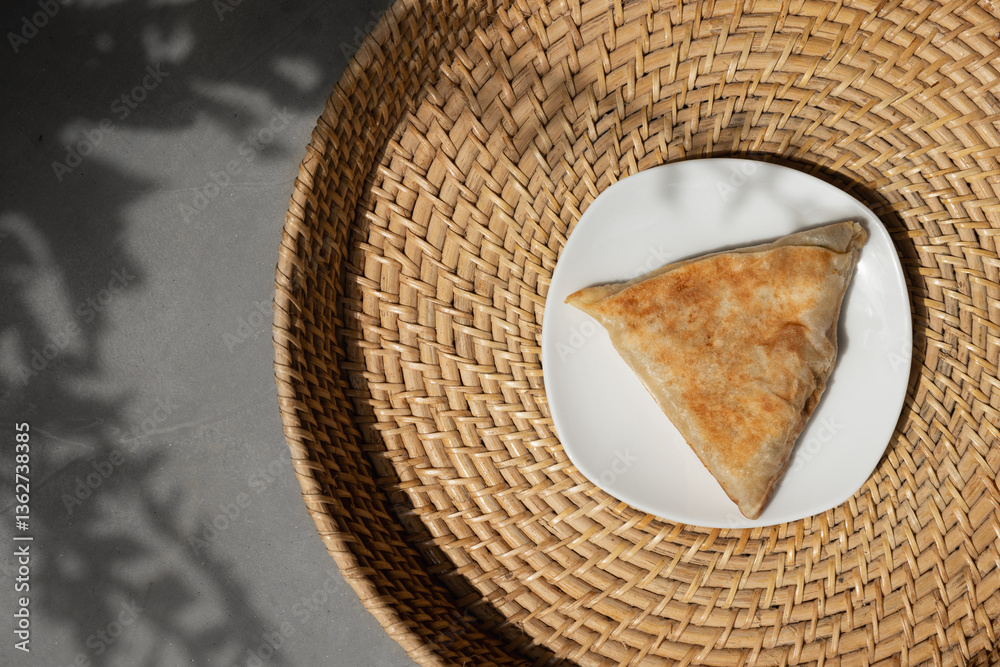 Vegetable roti in plate. Typical type of evening snack or breakfast in Sri Lanka. Asian cuisine. Sri Lankan street food. View from above. Copy space