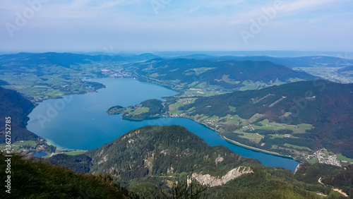 Obraz na płótnie Stunning aerial view of Lake Wolfgang (Wolfgangsee) surrounded by lush green hills and scattered villages, captured from Schafberg mountain in Salzburg, Austria on clear day in idyllic Austrian Alps w salonie