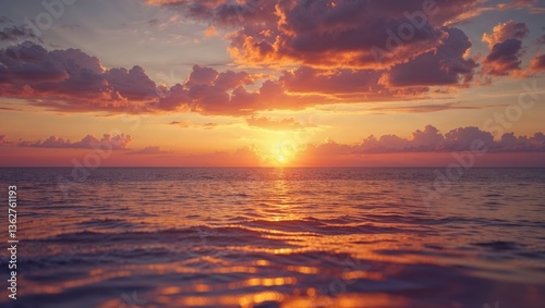 Beautiful sunset over calm ocean waters with colorful clouds in the evening sky