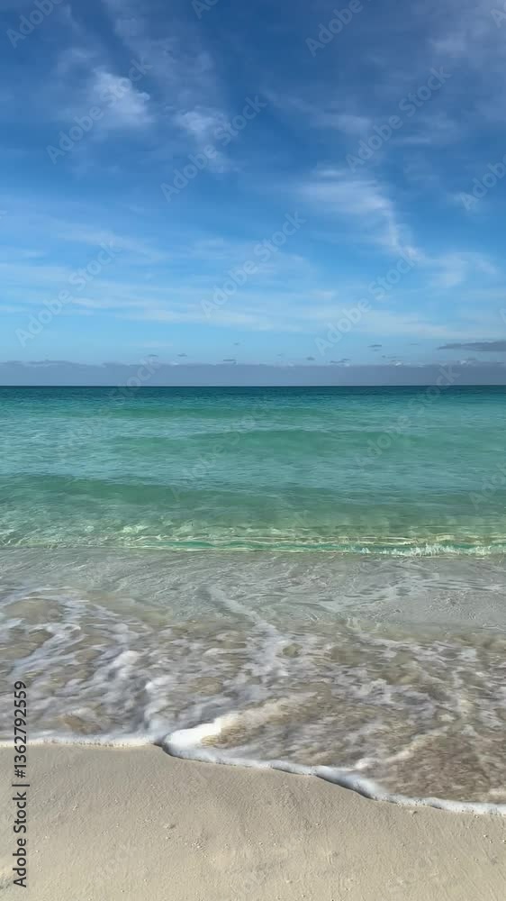 Waves gently lap against the shore in Cayo Santa Maria beach, Cuba
