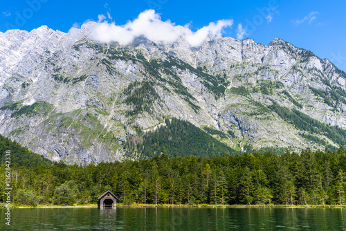 Stunning view of Konigssee Lake with peak Watzmann and Bavarian alps in background in Berchtesgaden national park on a sunny summer day from cruise ship, Schoenau, Bavaria, Germany