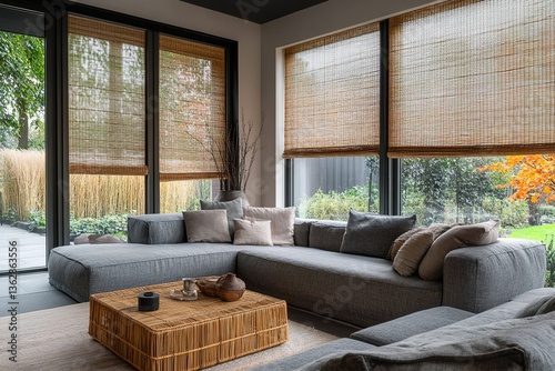 Modern Living Room Interior Gray Sectional Sofa, Rattan Coffee Table, Woven Shades