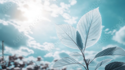 A vibrant green leaf gently sways against a bright blue sky, dotted with fluffy white clouds, creating a serene and refreshing natural scene that evokes tranquility and beauty.