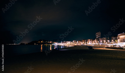 Night city central beach panorama. Lloret de Mar, Girona region, Spain. Costa Brava. Mediterranean Sea.