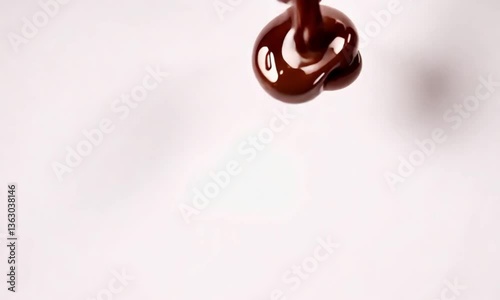 Heart of melted chocolate on a white background