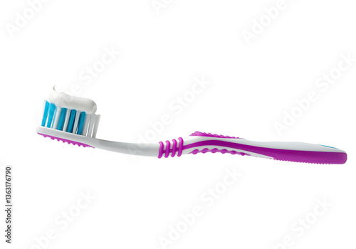 A floating toothbrush with fresh toothpaste on it, isolated on a solid white background.