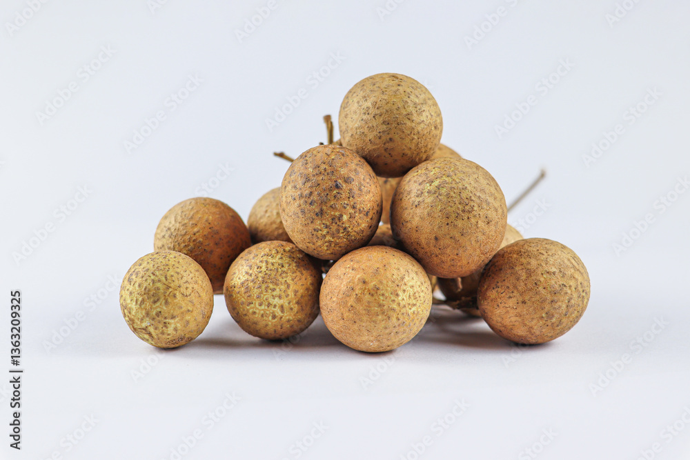 Pile of Fresh Longan Fruits with Speckled Brown Skin Pile of Fresh Longan Fruits with Speckled Brown Skin