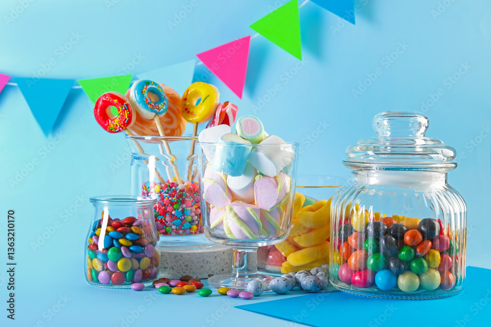 Candy bar. Many different sweets on light blue background Candy bar. Many different sweets on light blue background