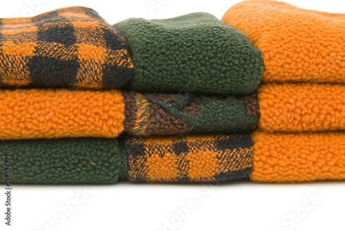 Pile of Plush Winter Fabrics with Textures and Earthy Tones Isolated