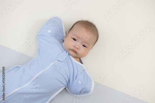 Obraz na płótnie Asian baby boy with wearing swaddle w salonie