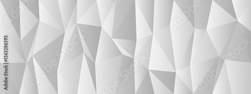 Abstract geometric pattern with dynamic triangles in white and gray tones for modern background design.