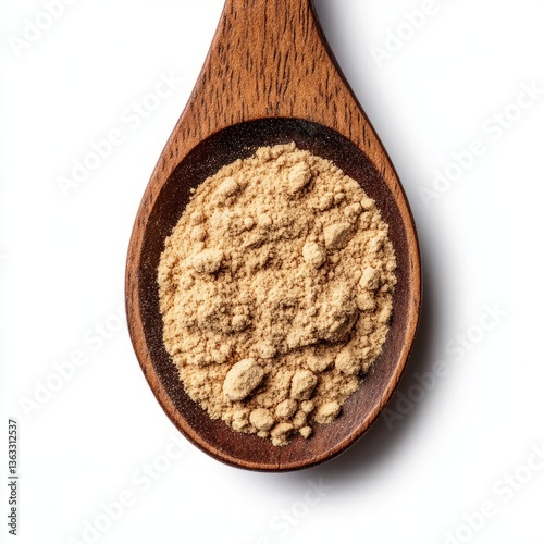 Wooden spoon filled with powdered garcinia cambogia supplement finely ground and rich in color isolated on a white background 
