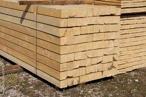 Stacks of wooden planks in sun light 